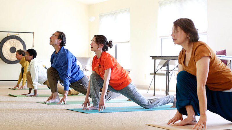 Diverse people practicing Yoga